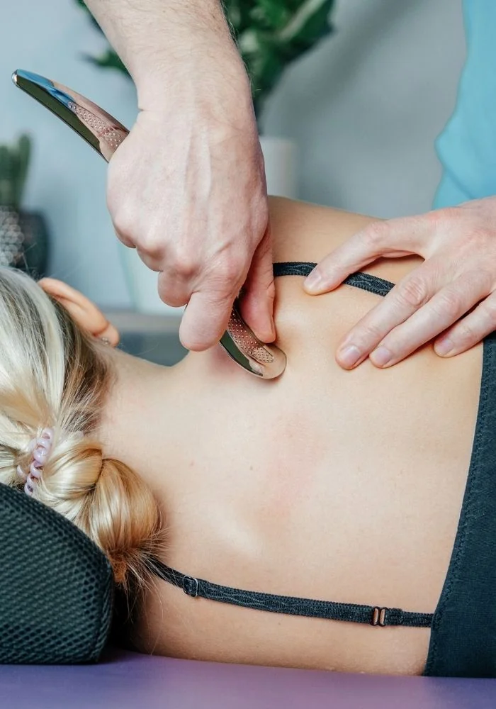 Chiropractor Blading on Shoulder Blades Chiropractor Blading on Shoulder Blades